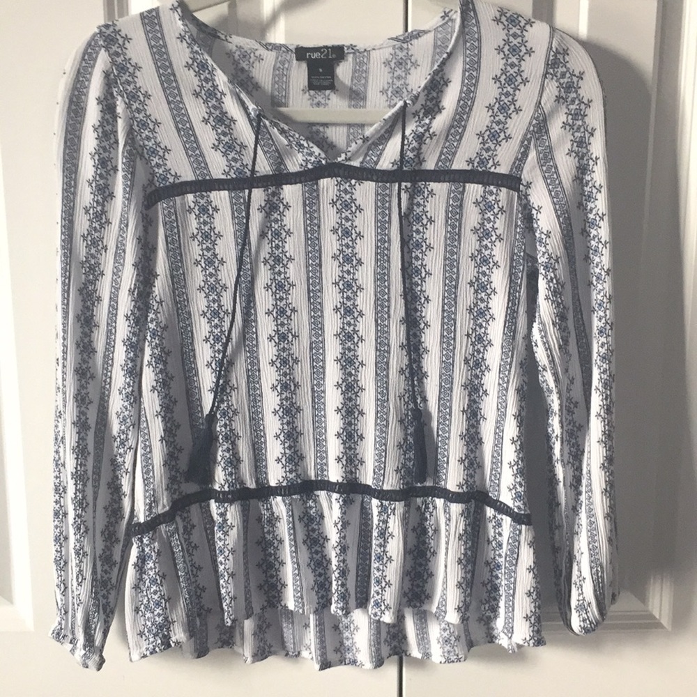White and blue patterned blouse